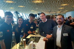 Marco Schöllig (right) and Adrian Münkel (2nd from right) with members of the TUfast team in the Business Club at the Allianz Arena in Munich