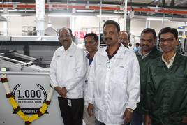 Operations Director BN Shukla (left) and Avinash V. Nalawade, Manager Manufacturing Engineering (front, white coat), with their new Ersa POWERFLOW – for Ersa, it is the 1,000th wave soldering machine in production