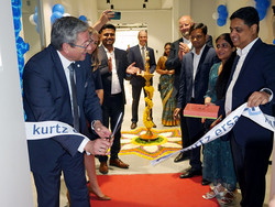 Rainer Krauss and Sameer Verma (front right) cutting the ribbon for the new India office